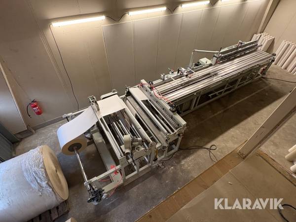 Automatisk maskin för tillverkning av pappersrör/ hylsor.