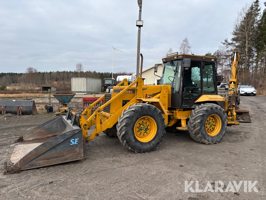Grävlastare Hydrema 906 med tiltrotator