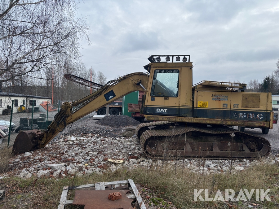 Grävmaskin CAT 215 BLC med skördaraggregat