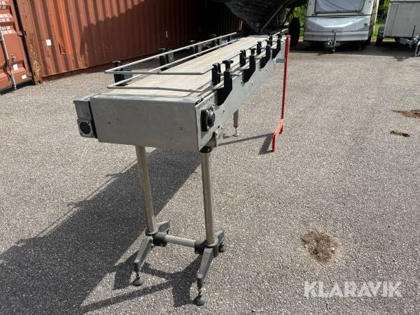 Slutstation, transportband