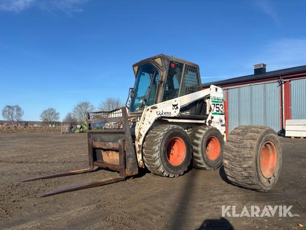Kompaktlastare Bobcat 753 - Med skopa och gafflar