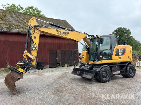 Grävmaskin CAT M314F med tiltrotator och planeringsskopa