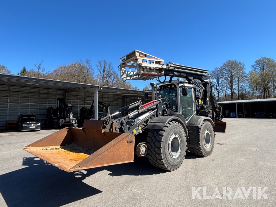 Traktorgrävare Huddig 1260C järnvägsutrustad