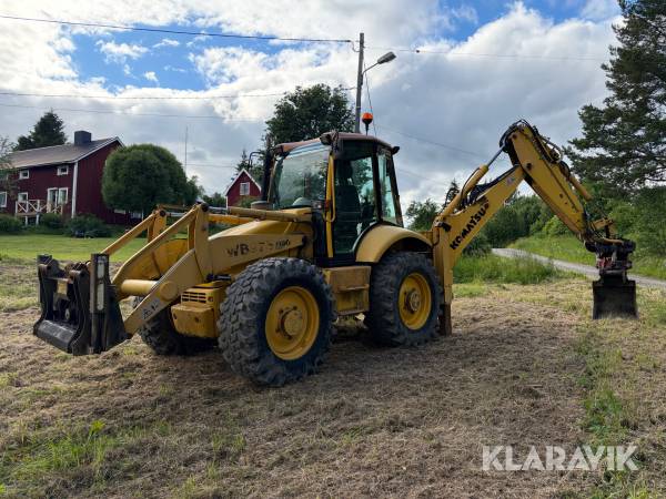 Grävlastare Komatsu WB97S med Skevfäste och redskap