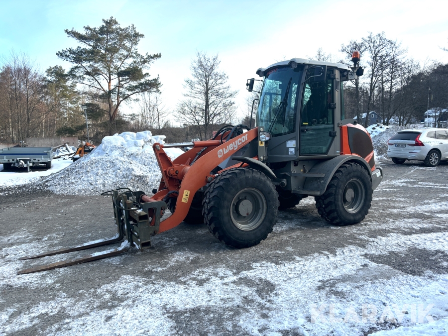 Hjullastare Weycor 65E med gafflar och planeringsskopa