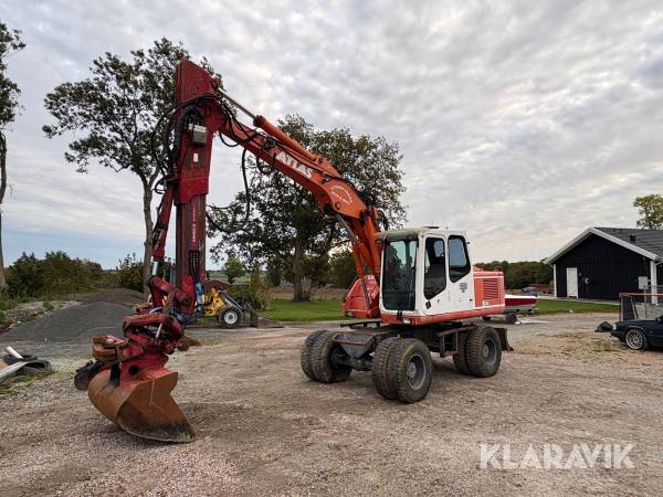 Grävmaskin Atlas 1504 med planeringsskopa