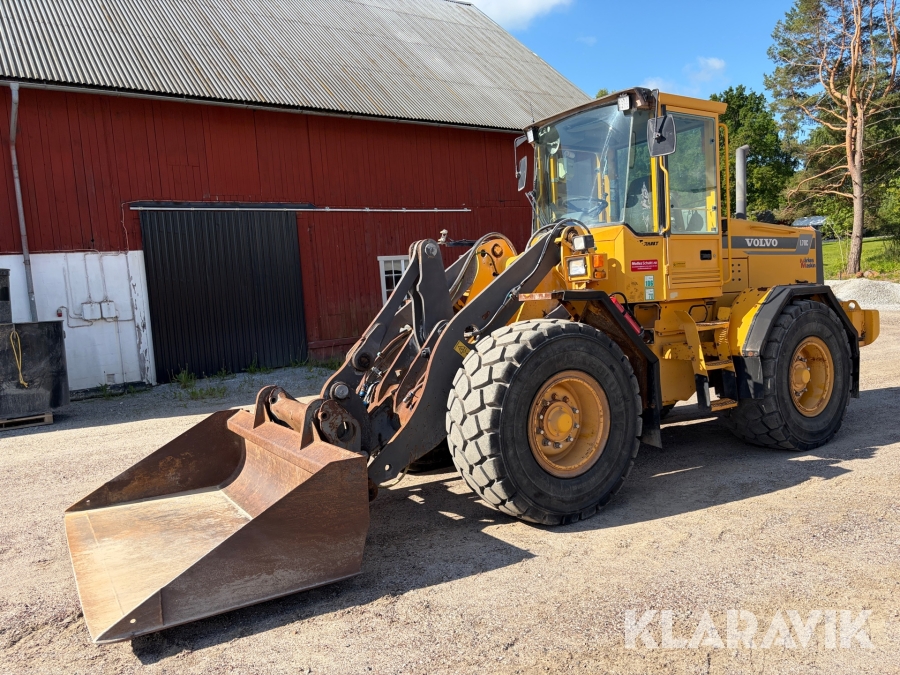 Hjullastare Volvo L70C med planeringsskopa och pallgafflar