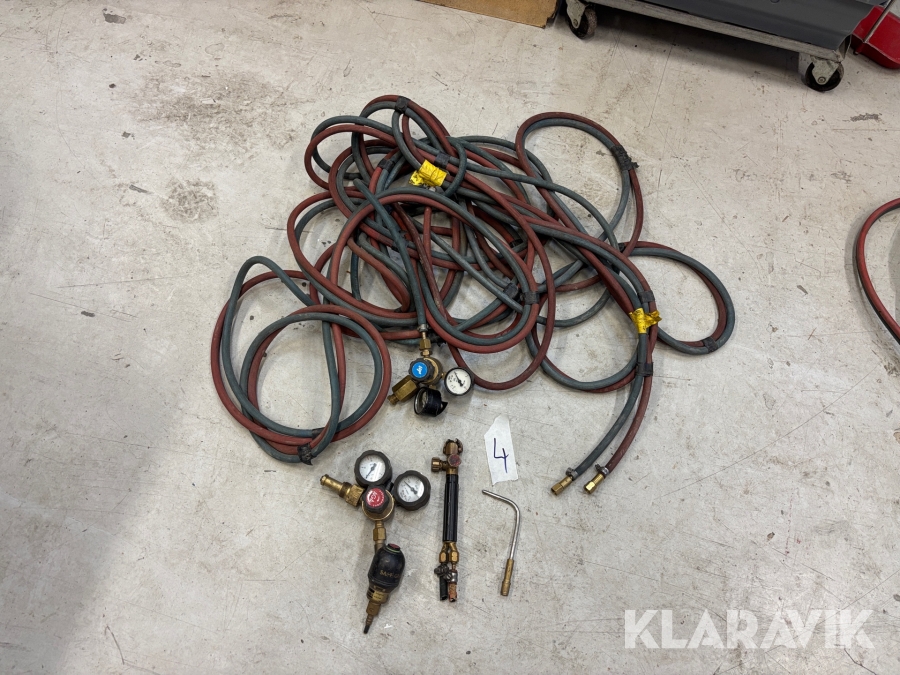 Gasslang med munstycke och gasklockor