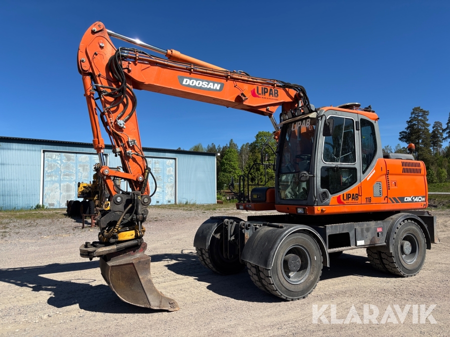 Hjulgrävare Doosan DX140W med tiltrotator