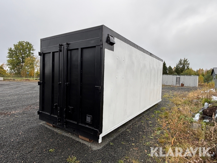 Container på lastväxlarflak med öppningsbar sida