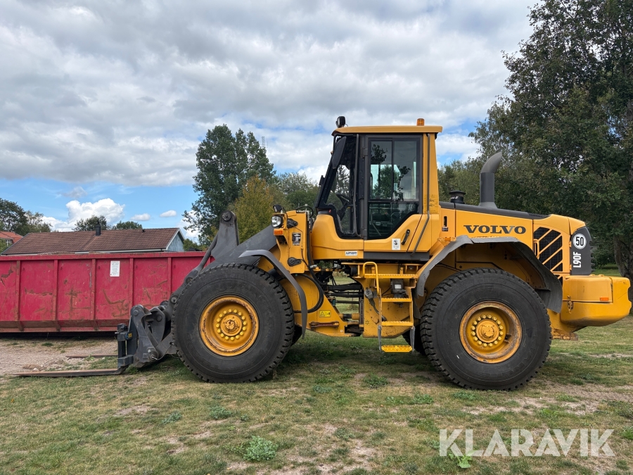 Hjullastare Volvo L90F med gafflar och skopa