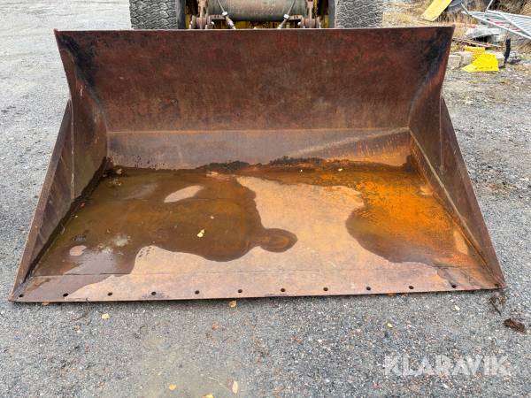 Planeringsskopa med förhöjd rygg