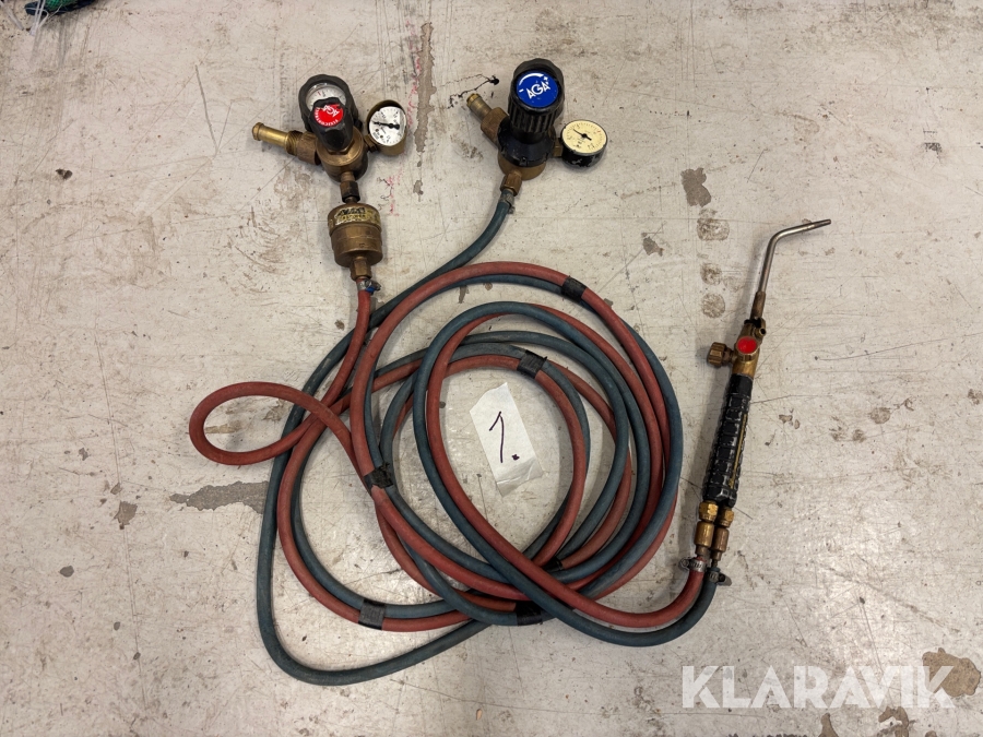 Gasslang med munstycke och klockor