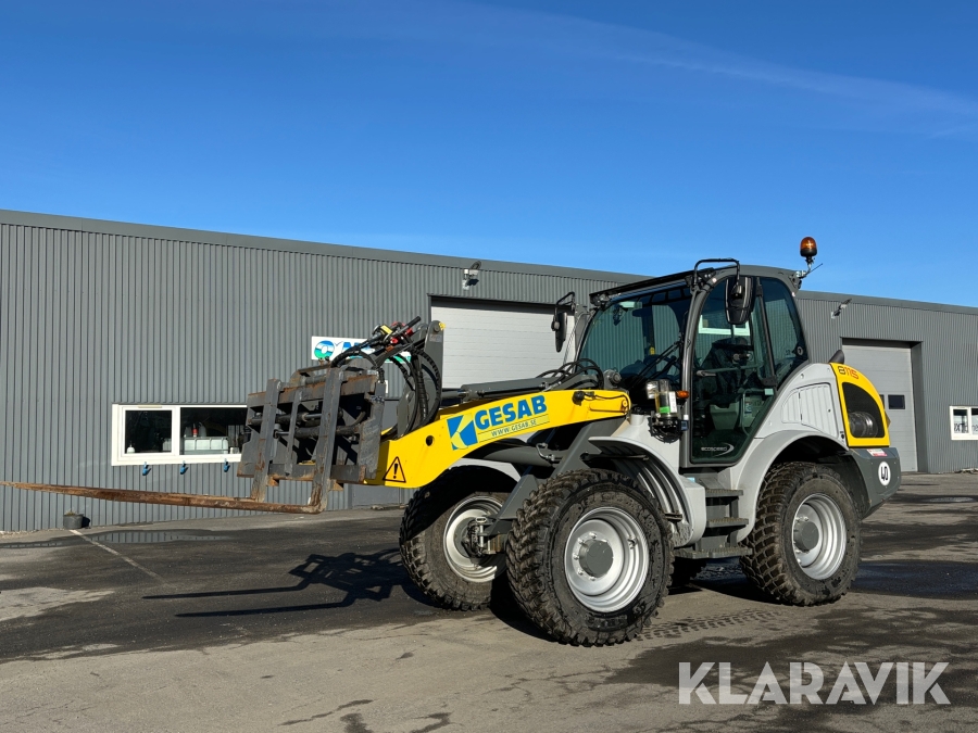 Hjullastare Kramer 8115 med vikplog, planeringsskopa och hydrauliska gafflar