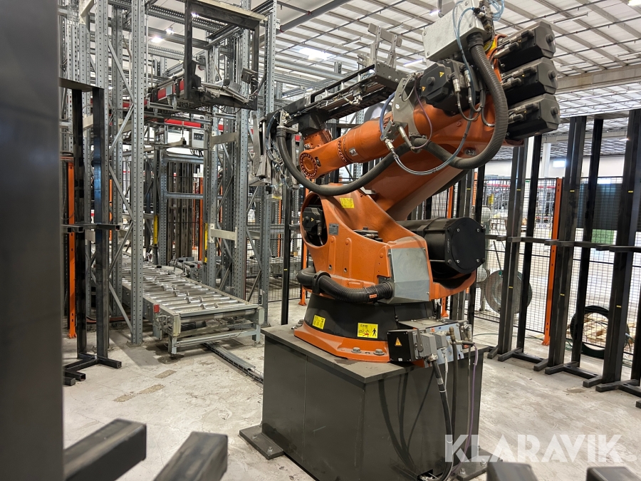 Packrobot Kuka KR 180 L150-2 2000 med styrenhet, avställningsstationer & skyddsbur