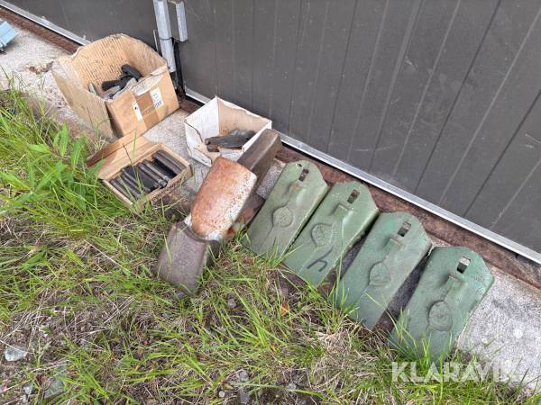 Tänder och låsningar Poclain