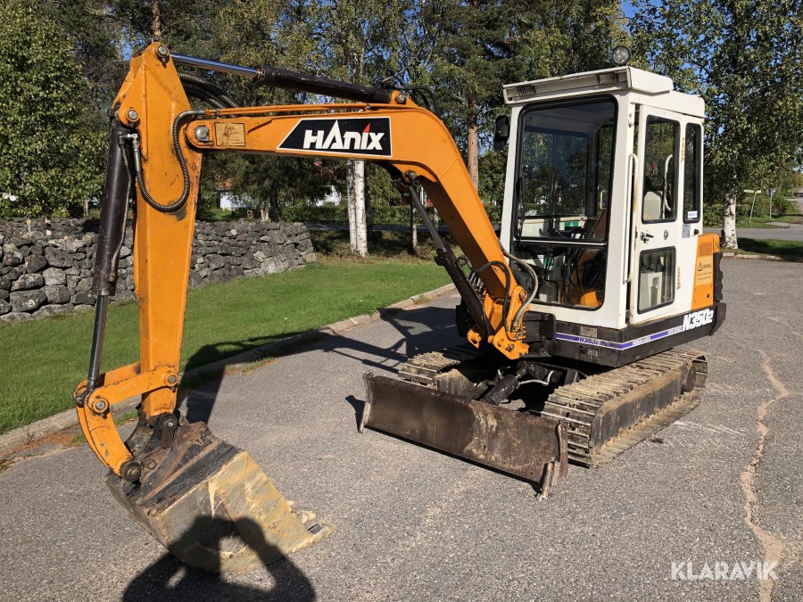 Bandgrävare med tandskopa