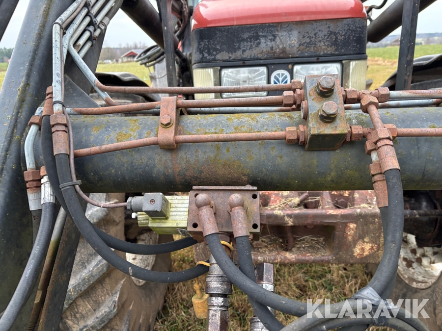 Traktor New Holland M135 4WD med trimalastare