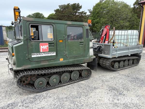Bandvagn Hägglunds BV206 med kranflak, vattenpump, tippflak och manskapshytt