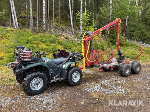 Fyrhjuling Yamaha Grizzly 450 med skogsvagn Kranman