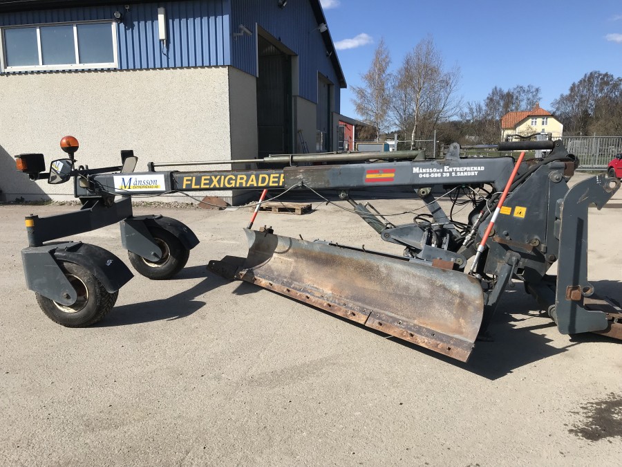 Väghyveltillsats till lastmaskin