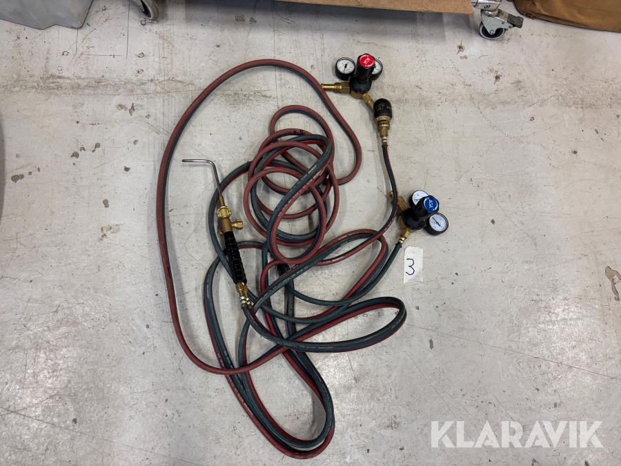 Gasslang med munstycke och gasklockor