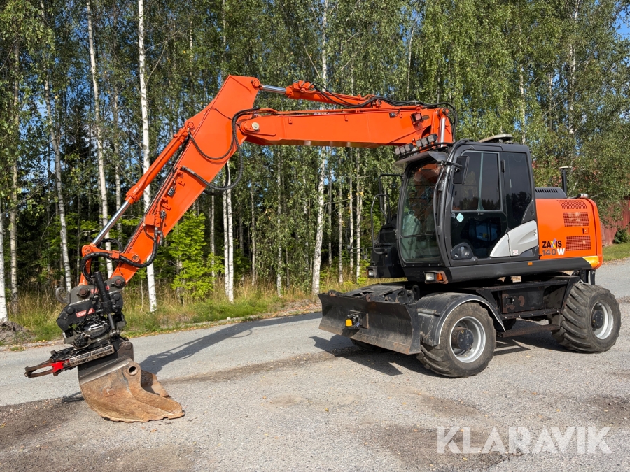 Grävmaskin Hitachi ZX140W-5B med tiltrotator och planeringsskopa