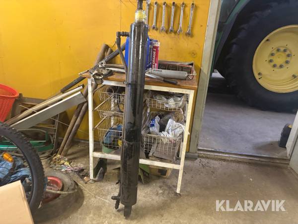 Hydraulcylinder och kraftöverföringsaxel med slirkoppling