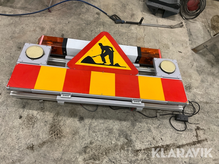 Takskylt med varningsljus